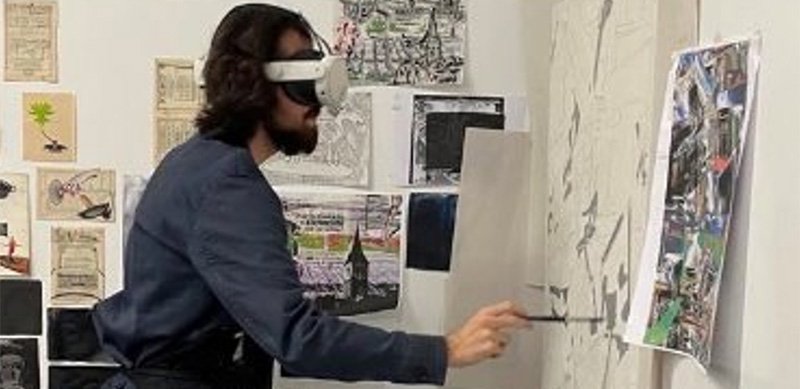 A learner using Contour on a virtual reality headset to produce artwork.