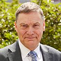 Headshot of Chris Husbands.