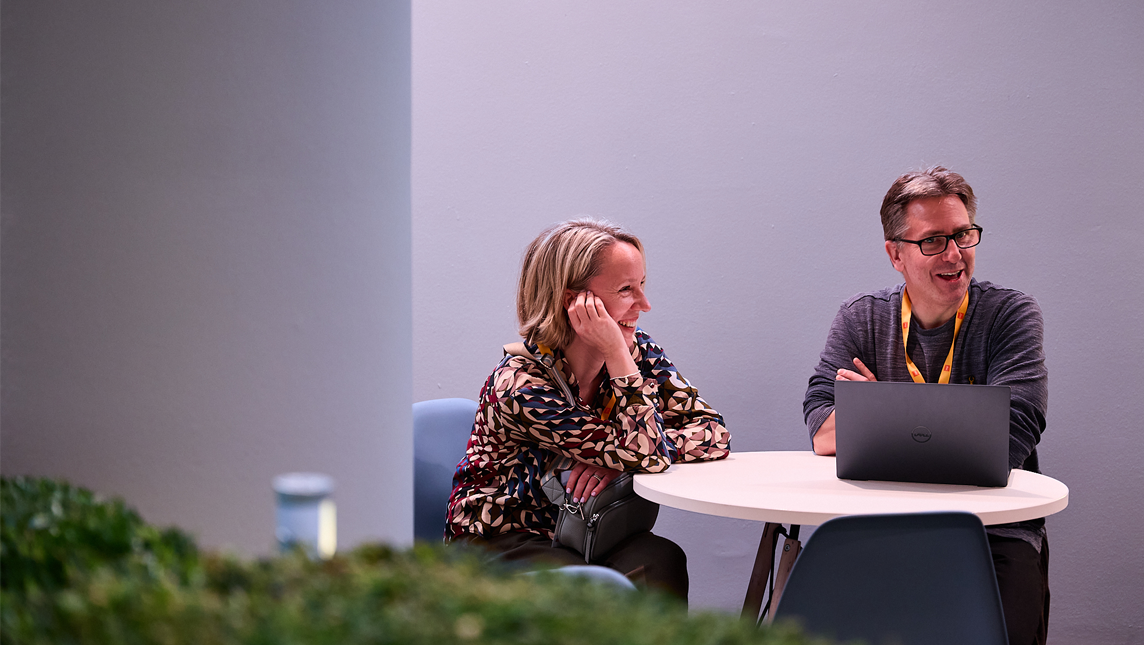 Two attendees having a discussion at Digifest 2025
