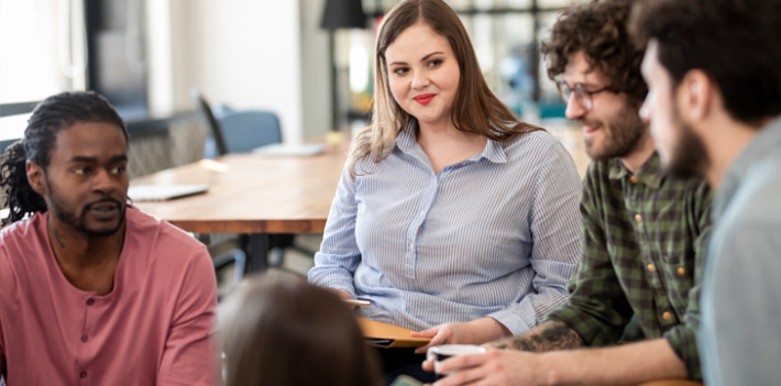 Group of young colleagues in discussion.