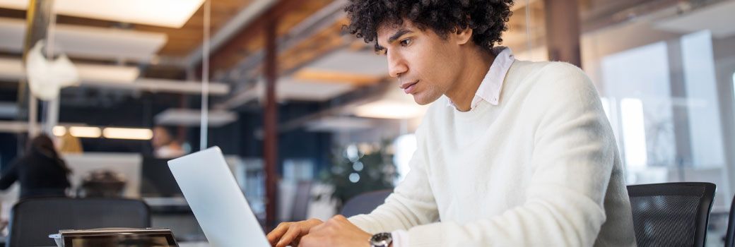 A male researcher in the library.