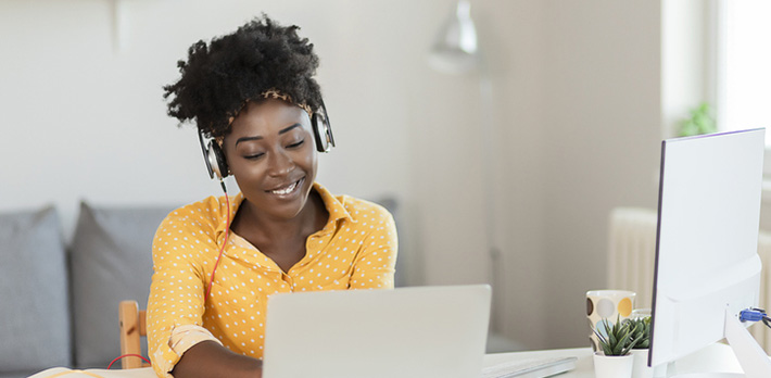 Adult learner studying on a laptop at home
